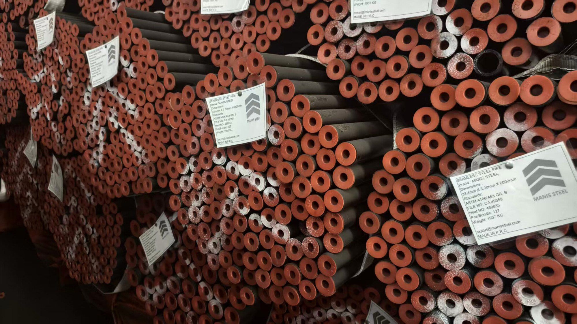 Stacked hexagonal pipe bundles, each with its own Manis Steel tag